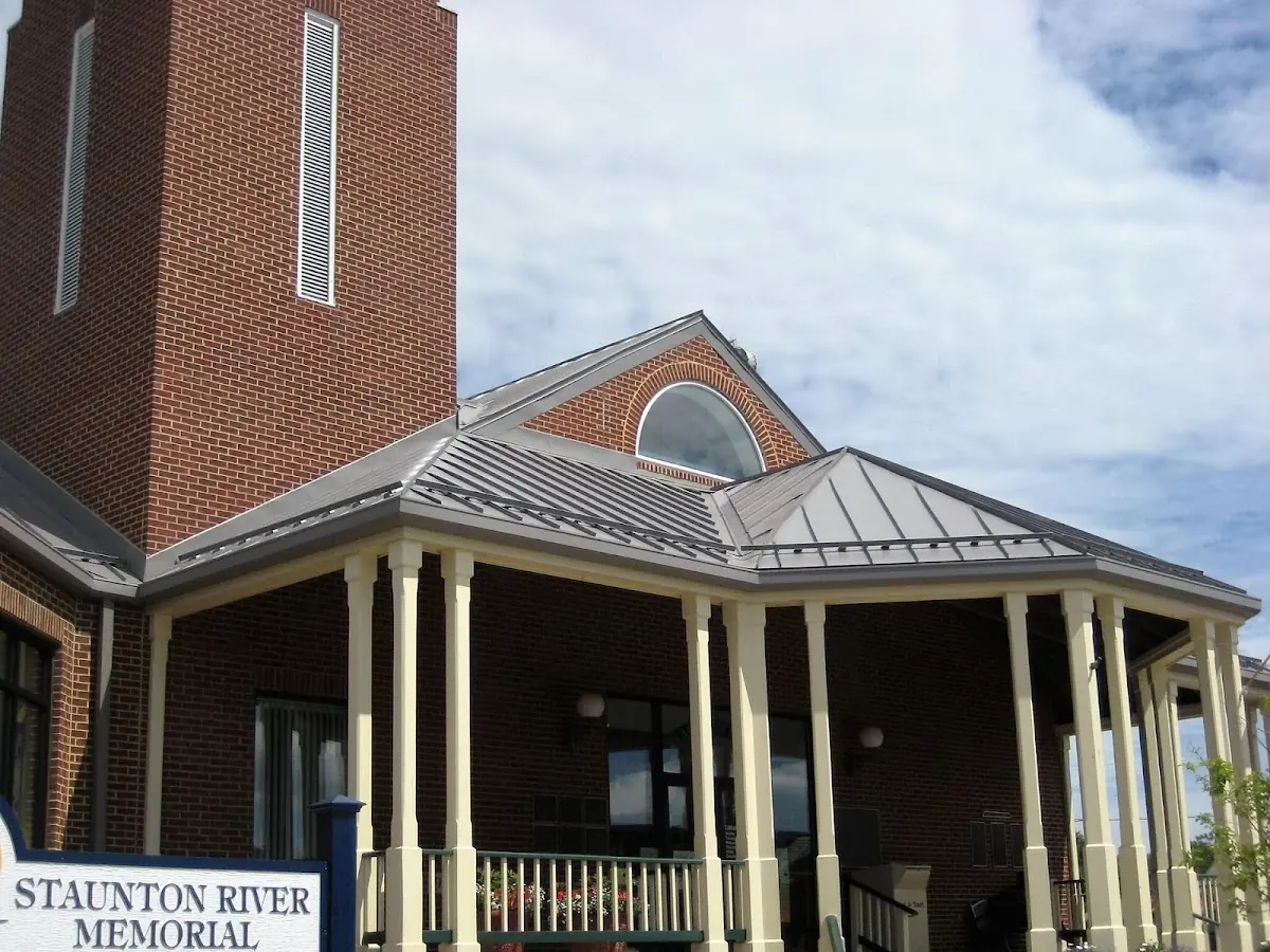 Skilled roofing craftsmen working on a residential roof in Wolfe City